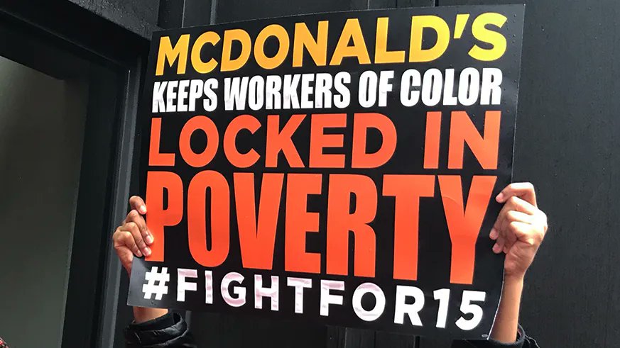 Sign: McDonald's keeps workers of color locked in poverty #fightfor15