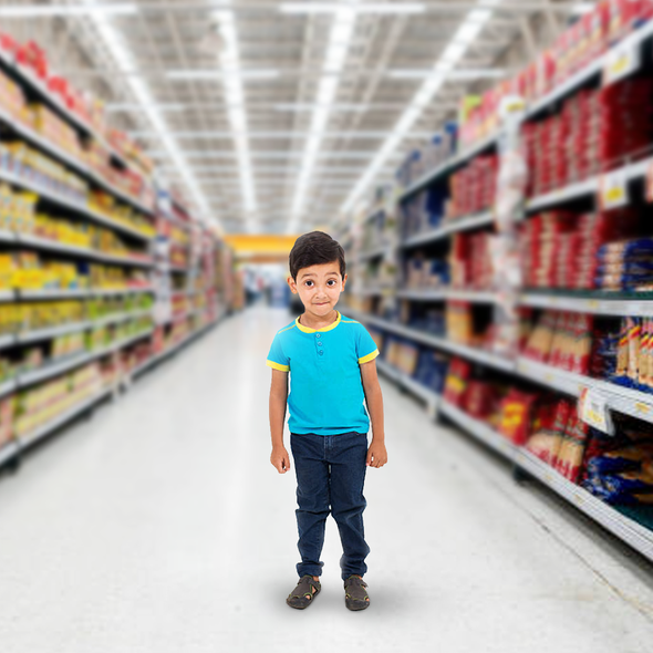 Little boy standing in the middle of a Walmart aisle