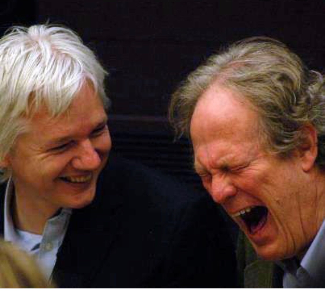 Gavin MacFadyen (Julian’s mentor) & Julian laughing in a private moment of joy 