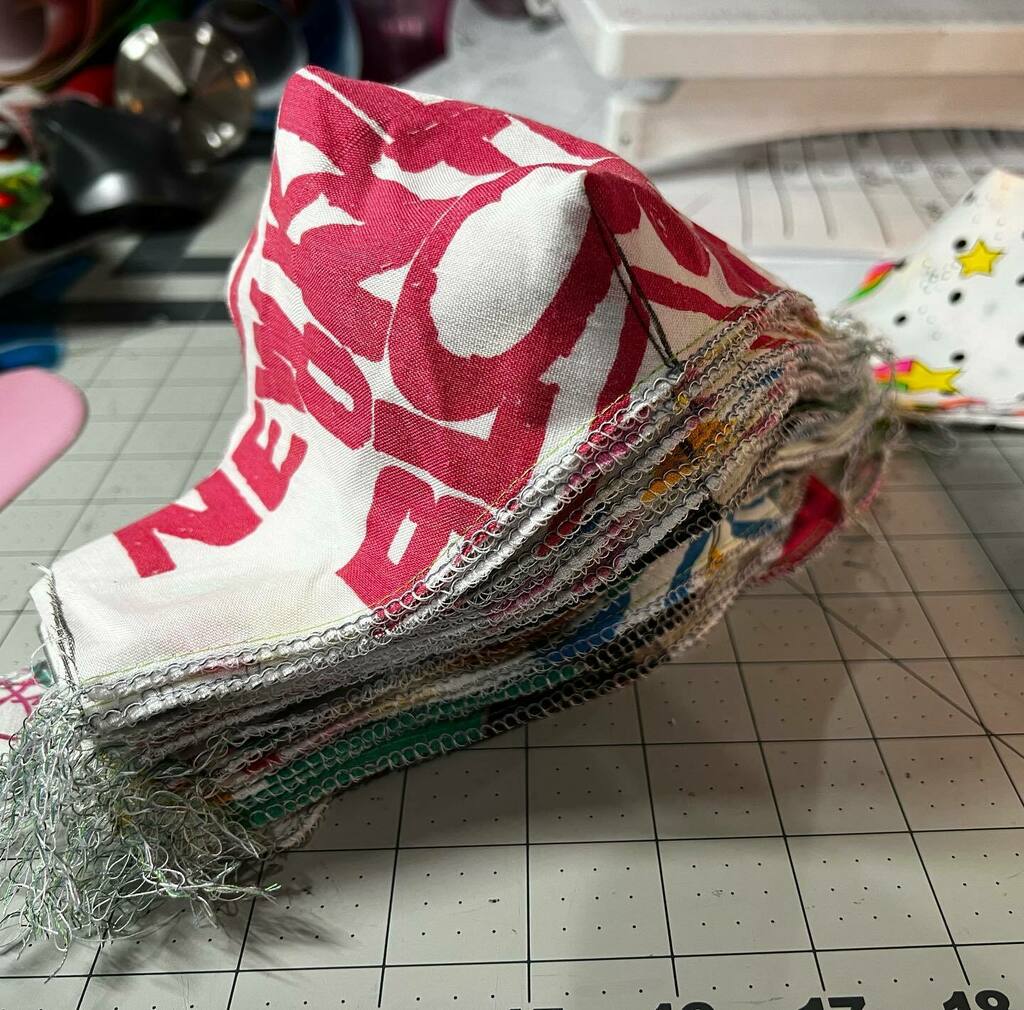 mask buyer update: I'm working through this stack! they'll be headed your way soon. 🎉✂️🧵

if you haven't ordered one, they are available and made to order at iheartnkotb.com with all proceeds going to @rememberbetty 💗 instagr.am/p/CYVwOnCLBi4/