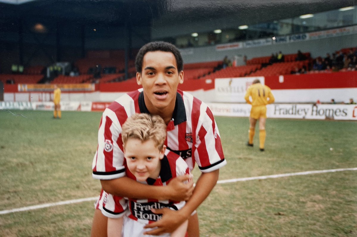 UTCstudio's tweet photo. Me Mum’s found some pics from when I was mascot! Swansea at home in 1992. Won 2-1 so I must’ve been lucky. #markstein #paulware #oohaahnoelblake #stokecity #leadingthepottersout #victoriaground https://t.co/b4OpwAn4dV