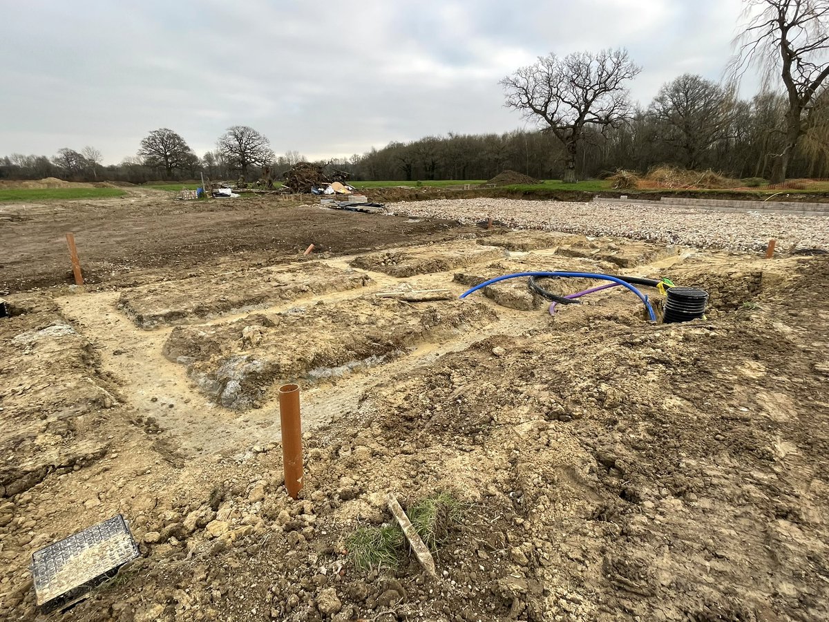 OmurcaLtd's tweet photo. Footings poured just before Christmas and retaining walls started at our new project. we are proud to have won this oak frame, exposed beams and stone facade new build. This project has a tennis court and external landscaping. #oakframe #newbuild #newbuildhomes #construction https://t.co/SnA3rhg1SW