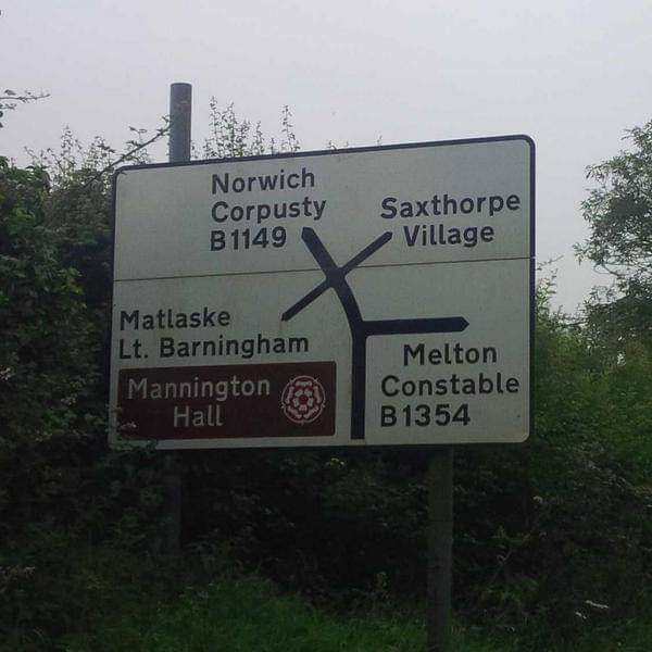What's that? You want to see a photo of a road sign that looks like a drunk person about to fall over? No problem...