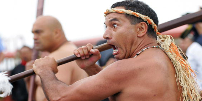 Temuera Morrison with a taiaha (spear) .