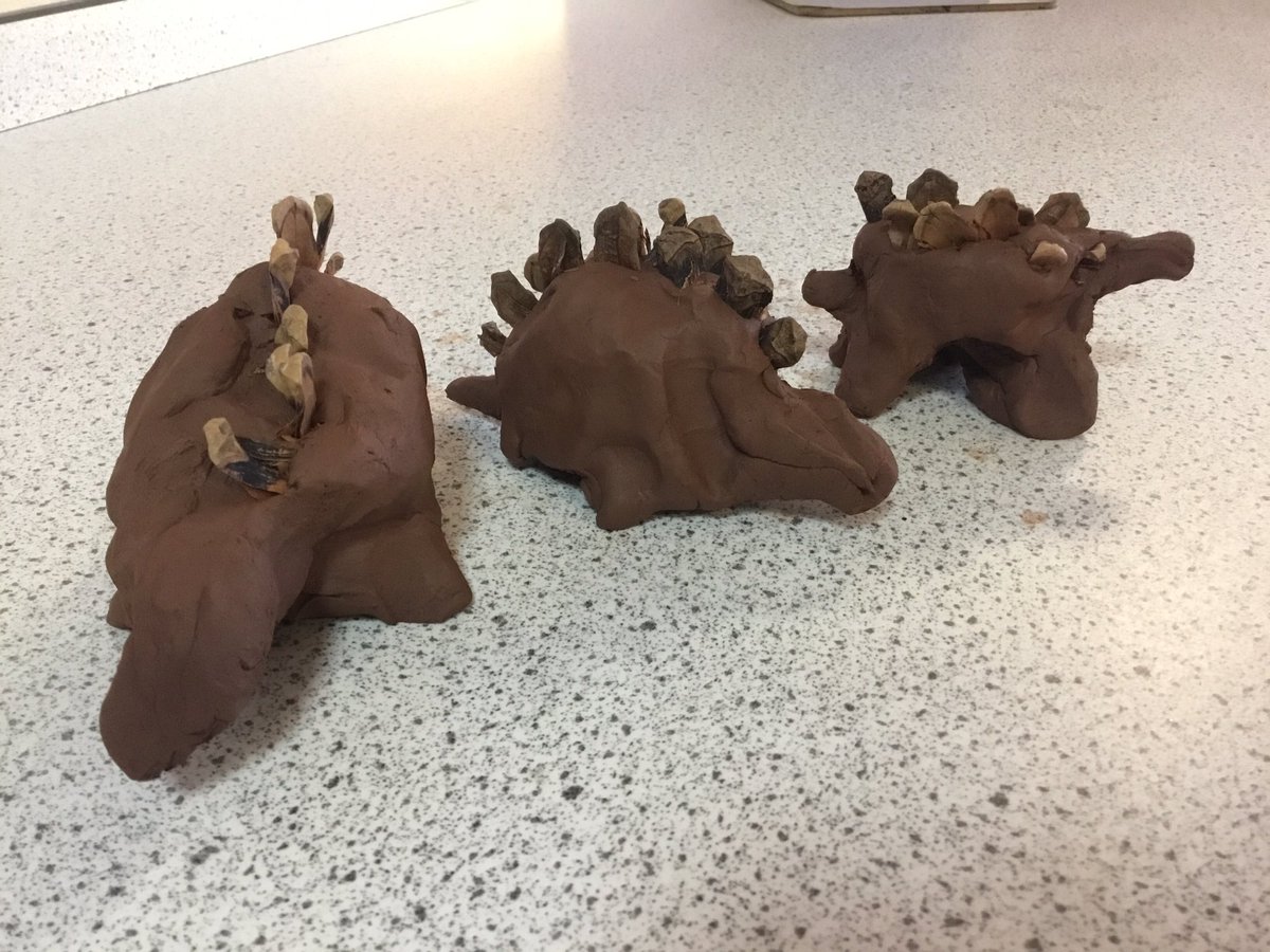 Happy new year! Red 1 explored wet and dry clay today. We compared the different states of the material and explored what happened when the truth of dried clay had water poured into it. It hissed and gurgled! We then made thumb pots which we turned into dinosaurs! <a href="/bentondenesch/">Benton Dene School</a>