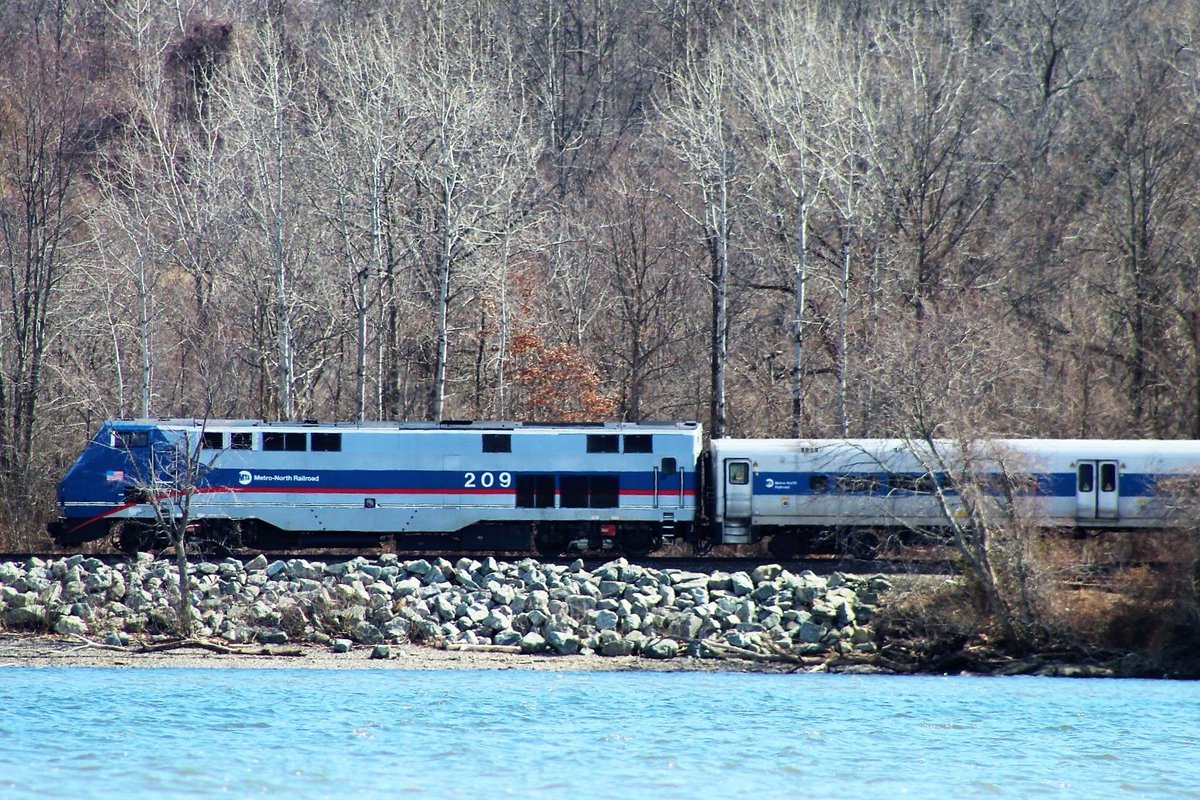 A Metro-North train with a view of the Hudson River.