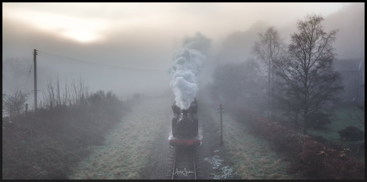 AndyShukie's tweet photo. The Lake District. The Santa Special on The Lakeside and Haverthwaite Railway coming through the fog at Newby Bridge  @lakesiderailway @images_lake @TheLakesGuide @WesternLakes #cumbria #lakedistrict #fog #steamrailway https://t.co/8sggWb6Am5