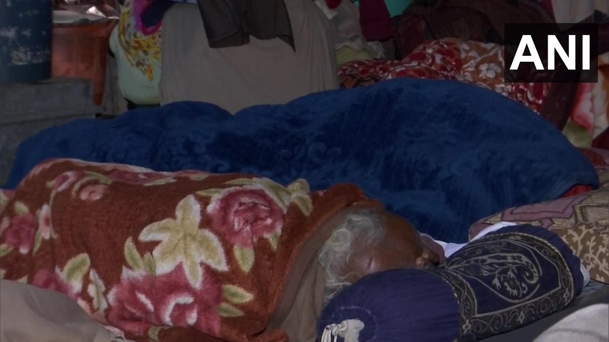 ANI's tweet photo. Delhi: People take refuge at a night shelter in Lodhi Road, as temperature dips in the national capital

"Today many people are coming here because of the rain. We provide them many facilities including blankets, hot water, medicines," says Manoj Kumar, caretaker of the shelter https://t.co/pMf6ZX5DIH
