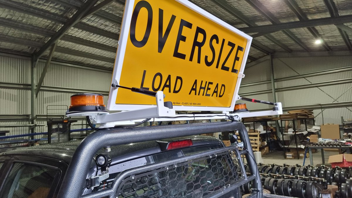 Oversign Load Ahead Sign and Lights. Black frames with a gas strut or electric actuator are in stock now. White also available. Various options for ute head board and roof rack mount.  Australian Made.