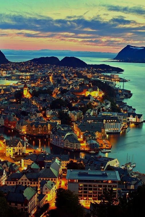 Magical colorful view of Alesund at sunset. Norway 🇳🇴❤️💙🧡💚
