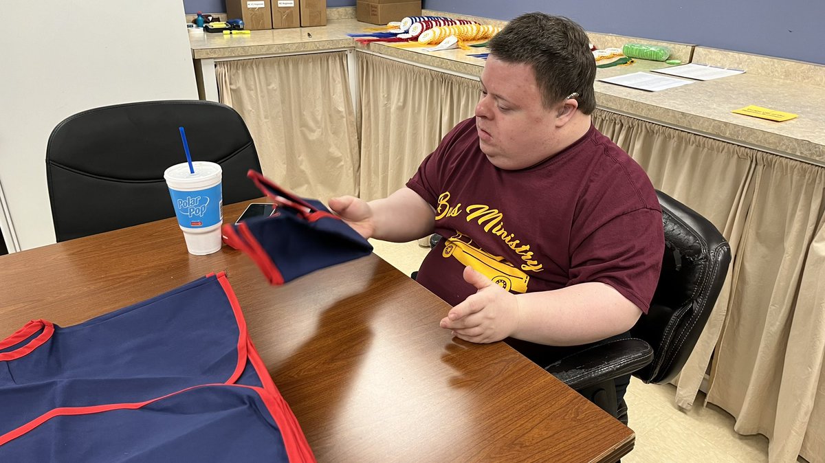 MasterClubs's tweet photo. Paul Thomas, one of our most faithful volunteers, is folding Master Clubs vests today as they prepare for shipment. Don’t tell Paul that you cannot serve the Lord if you have Downs! https://t.co/7NO3uyOMbL