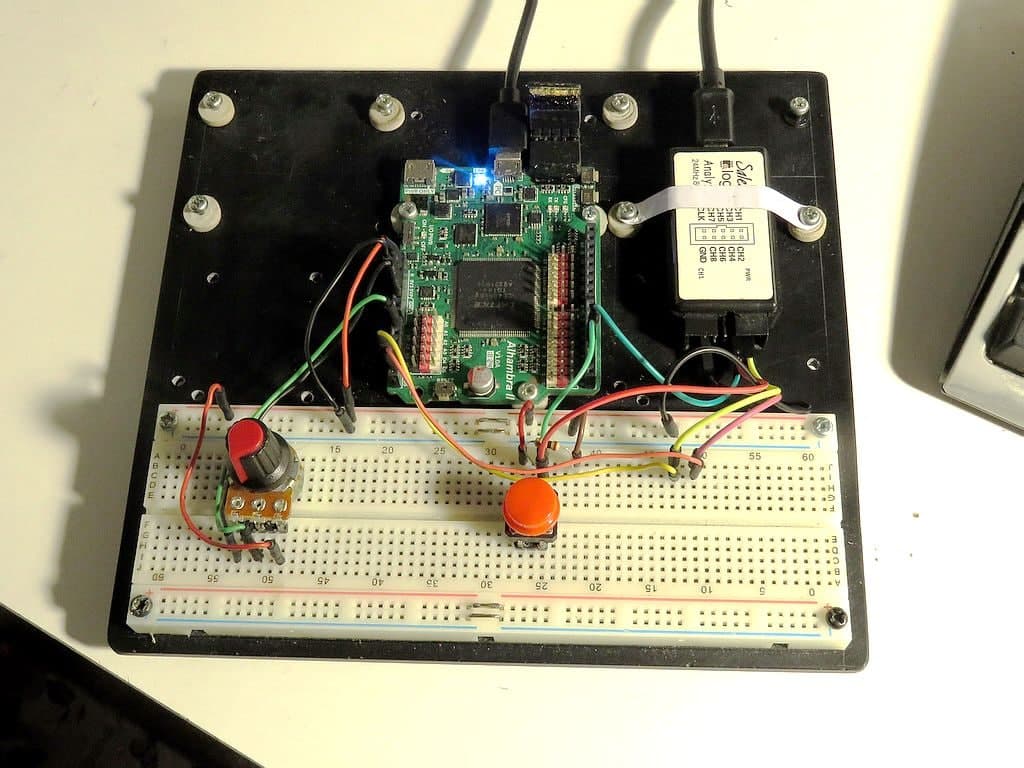 Hace un par de días, comencé un montaje para realizar algo de ingeniería inversa al conversor ADC AD7924 que lleva la Alhambra II de y su protocolo I2C, añadiendo para ello un potenciómetro, un pulsador y un útil y económico clónico del analizador lógico Saleae, de tan solo 8€.