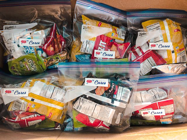 RMHCCF's tweet photo. As AAA National Headquarters reopened in December, each returning wave of employees participated in a AAA Cares event. After three sessions, the @AAAnews team created a total of 4,000 snack packs for our families! Thank you for choosing RMHCCF!!  #KeepingFamiliesClose https://t.co/yZUcwjb1bg