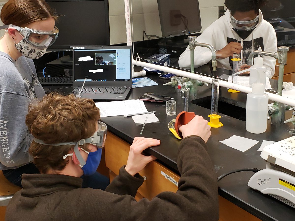 GsstChemistry's tweet photo. As the chemistry students worked on their lab today, a few of their classmates who were quarantining at home were able to Zoom in.  Proud of how our students work collaboratively to complete the lab activity in class and support their peers at home!  #GSST @NHGSST https://t.co/IrAPASNgtw