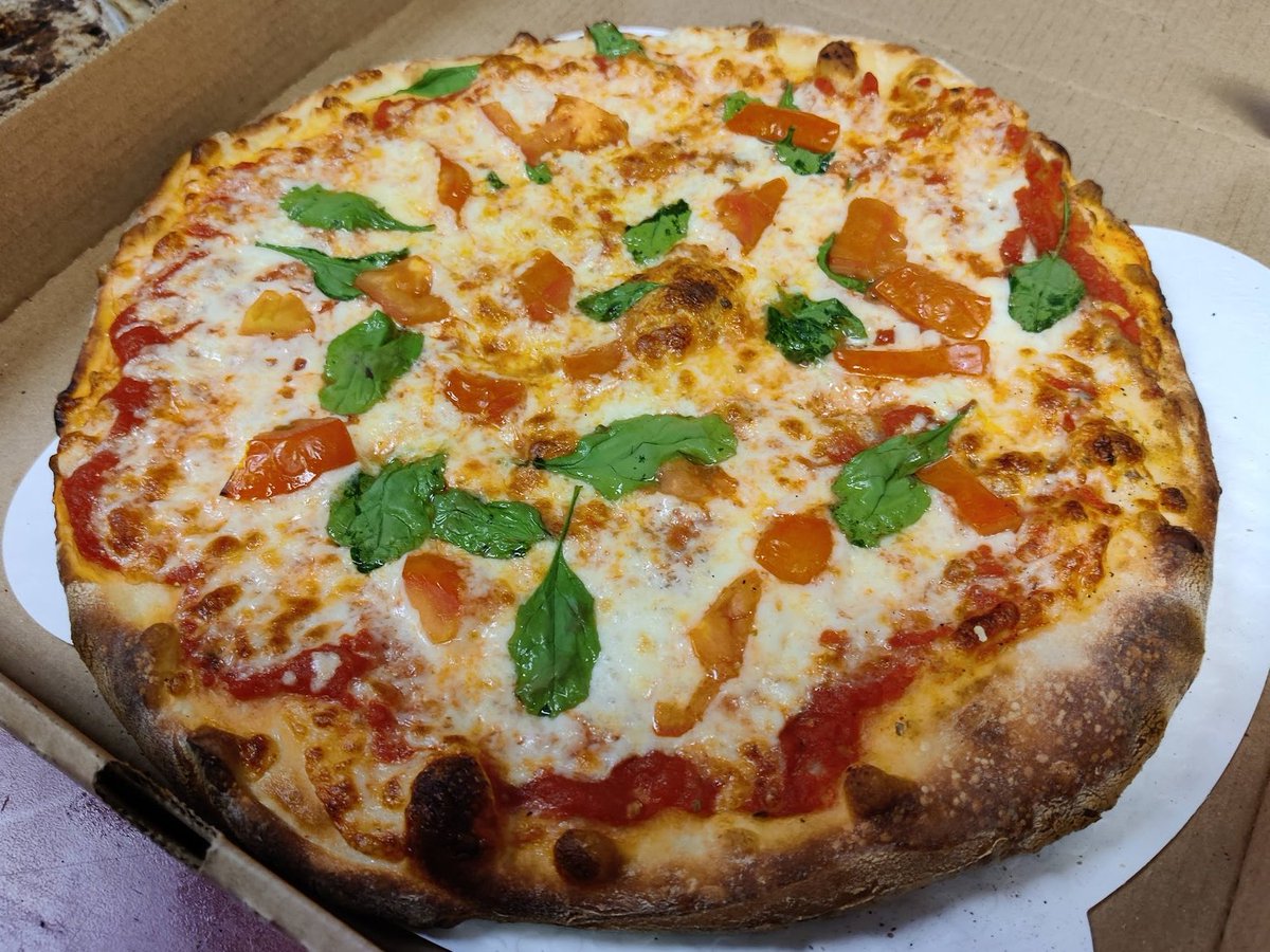 FranksOmaha's tweet photo. Another unique customer creation: Spinach and Tomato pizza.  Come make your own unique pizza at Frank's Pizzeria! https://t.co/juHEyXmT3n
