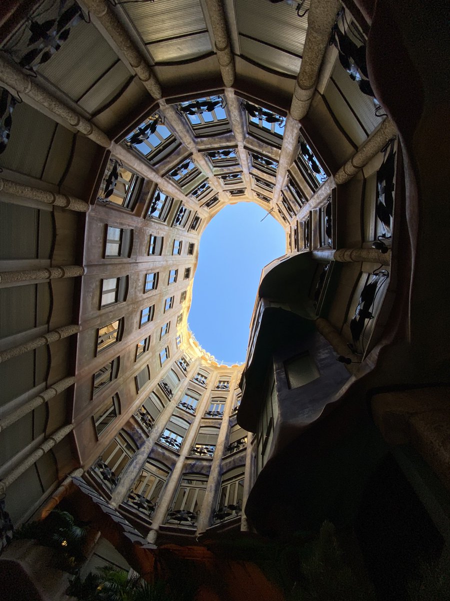 Looking down Casa mila model vs looking skywards in its reality. Gaudi.
