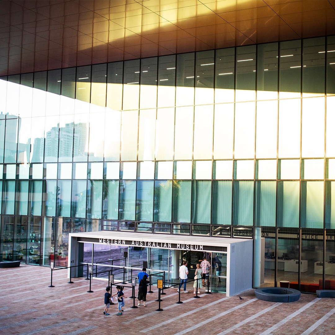 Exterior of WA Museum Boola Bardip at the entrance with a group of people in line to enter.