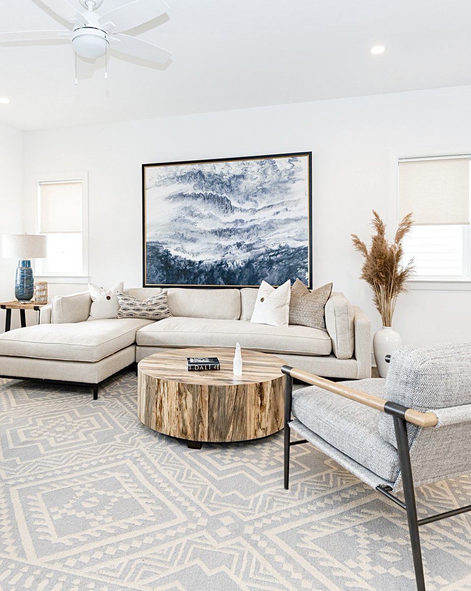 Waking up to the first SNOW of the year has us reminiscing about this fabulous California inspired beach home we designed in Ventnor, NJ✨ The mission for the living room furnishings was to embrace a modern coastal feel with light, neutral rugs, modern furniture, driftwood tones!