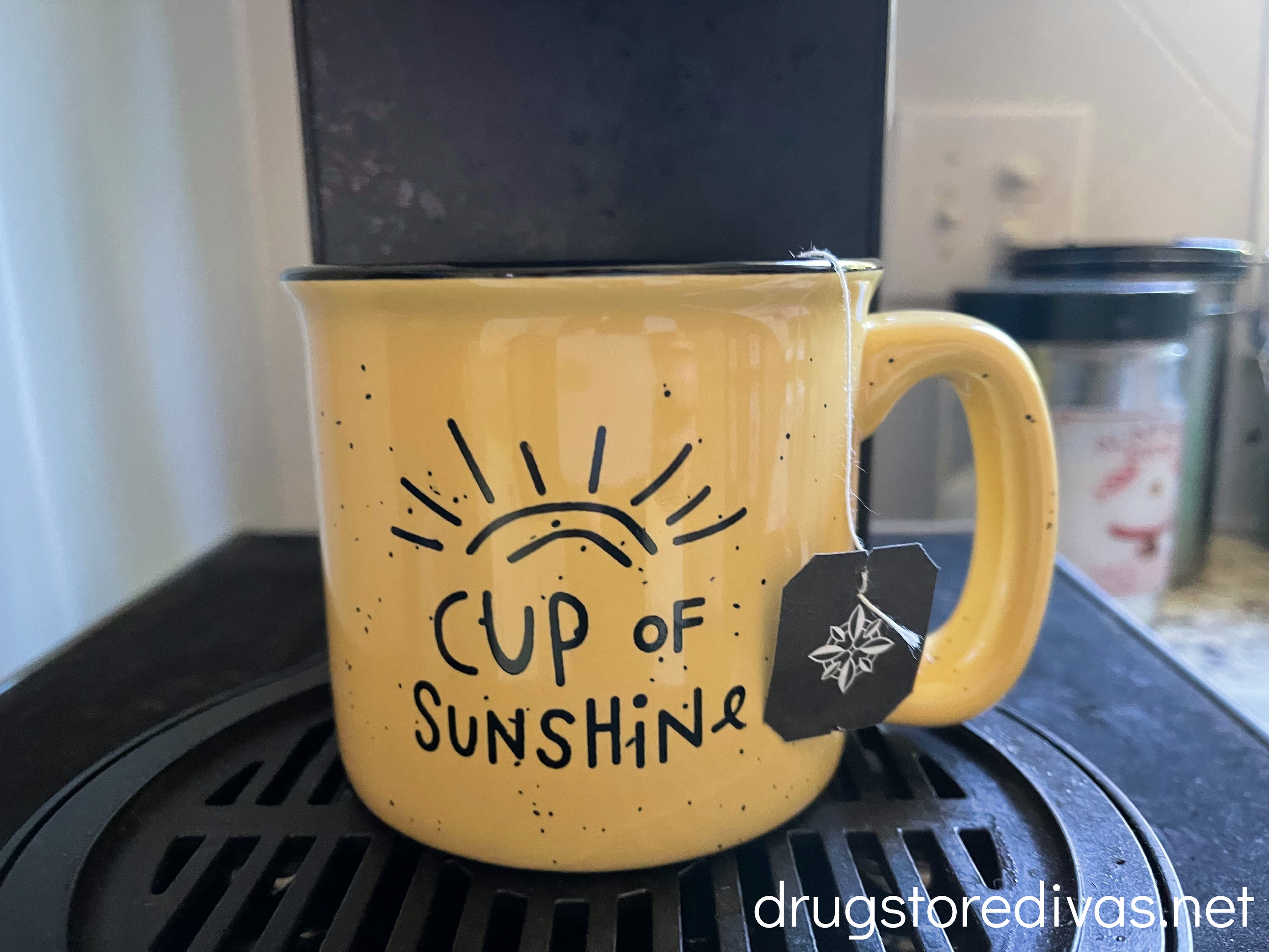 A coffee mug on a coffee brewer.