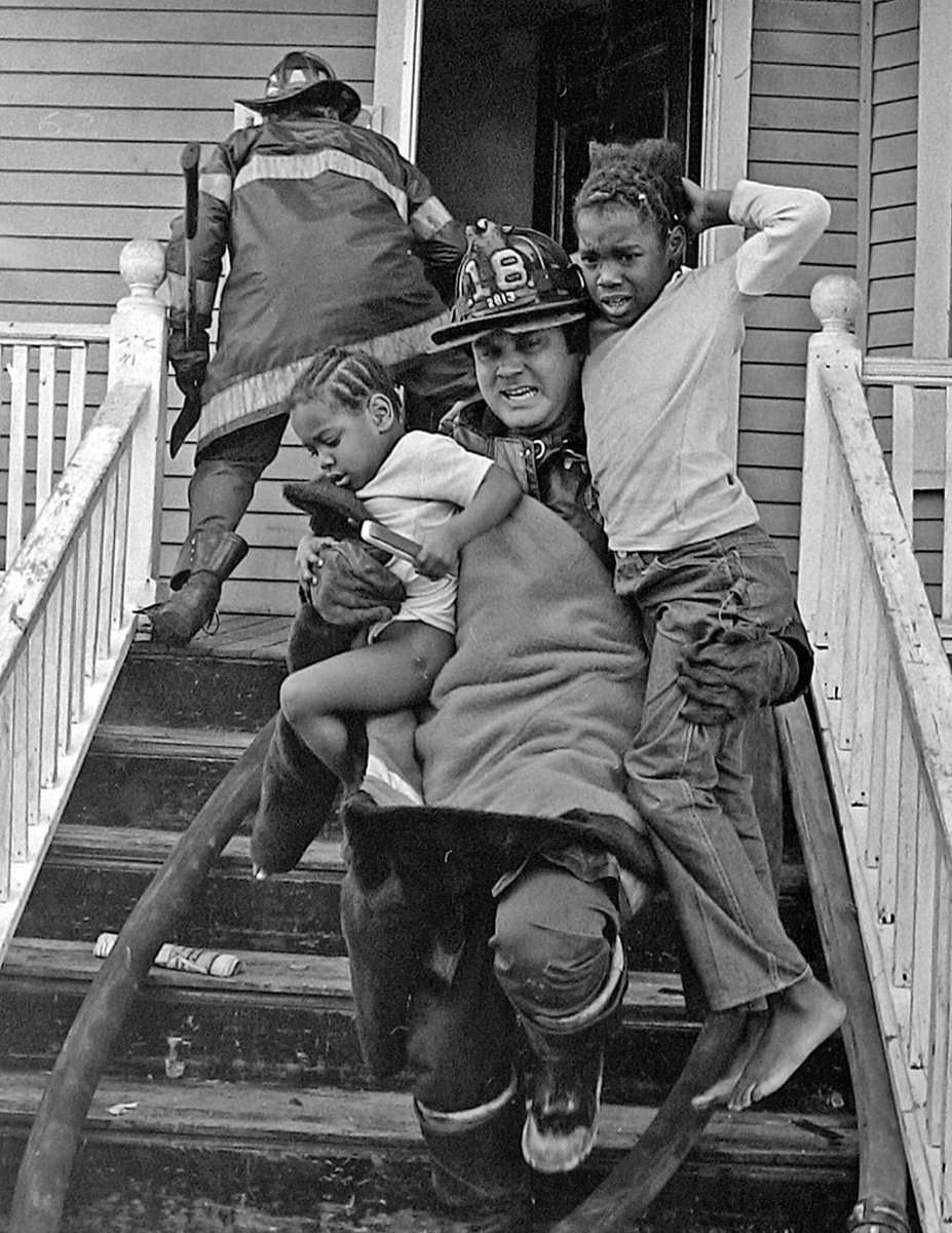 Joe Gilmore of Engine 18. Children found on the second floor. 1978. Photo: George Rizer