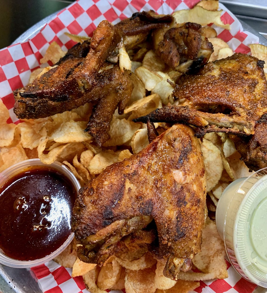 Jamaican Jerk Chicken Wings!  Whole, jumbo wings dry rubbed in our house jerk seasoning, served over a bed of spiral chips and a side of Jerk Sauce!  

#jerkspice #jerkchicken #flavorgods #chickenwings #wholewings #grilledwings #cootiebrowns #realfood #appetizer