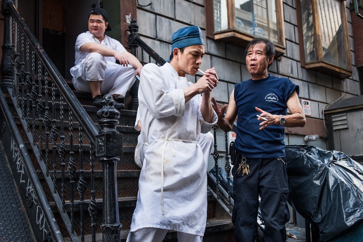 MirelesPhoto's tweet photo. Scene outside a Chinese restaurant in the #LowerEastSide of #NYC. The kitchen staff slips out the back for regular smoke breaks. In true NYC style, the conversations are always animated. #streetphotography #fujifilm #nftart https://t.co/cbK0cXIfb2