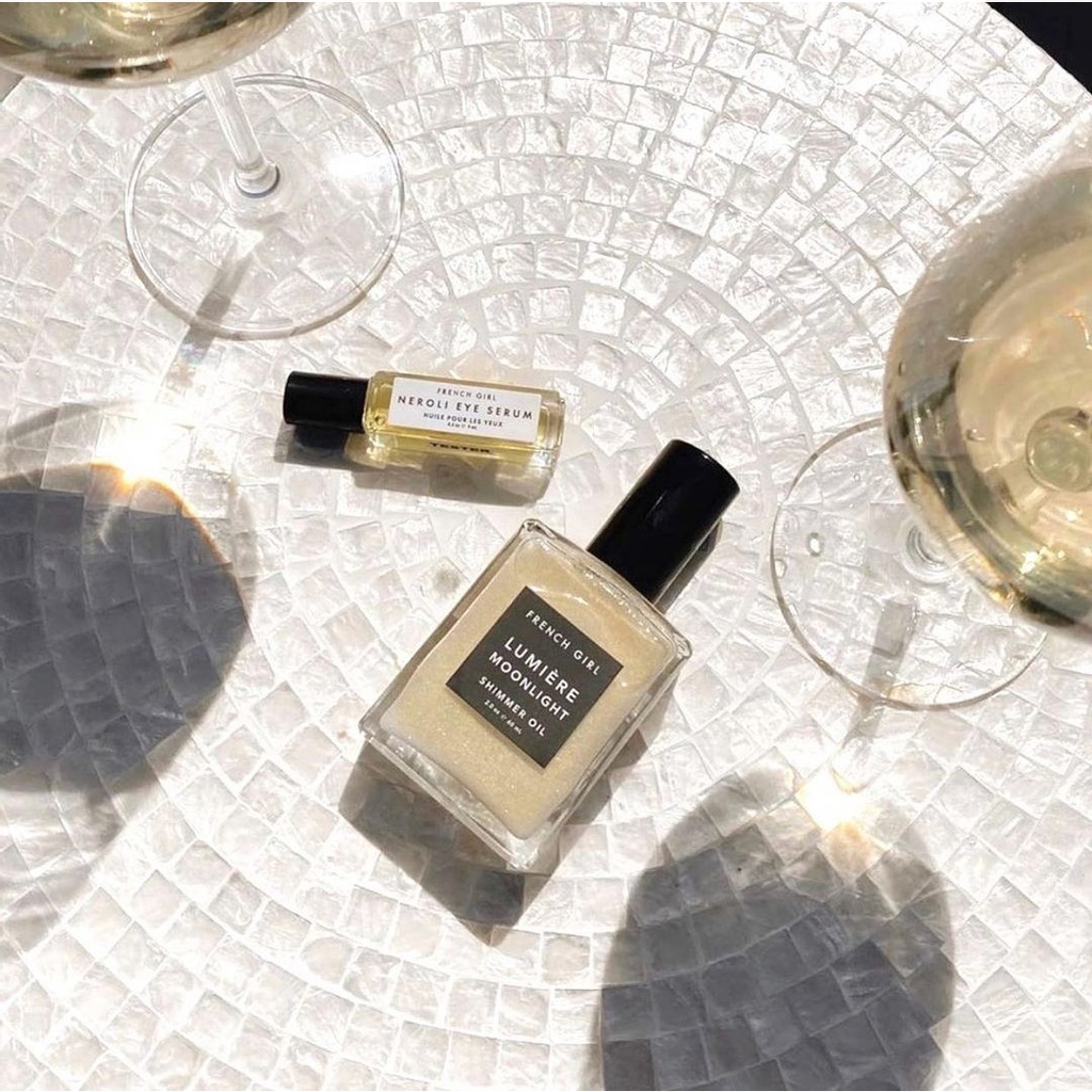 Starting the weekend with a color story—Shimmer Oil, Nèroli Eye Serum and crisp white wine. ⁠
⁠
 📸 : @styledbygagan