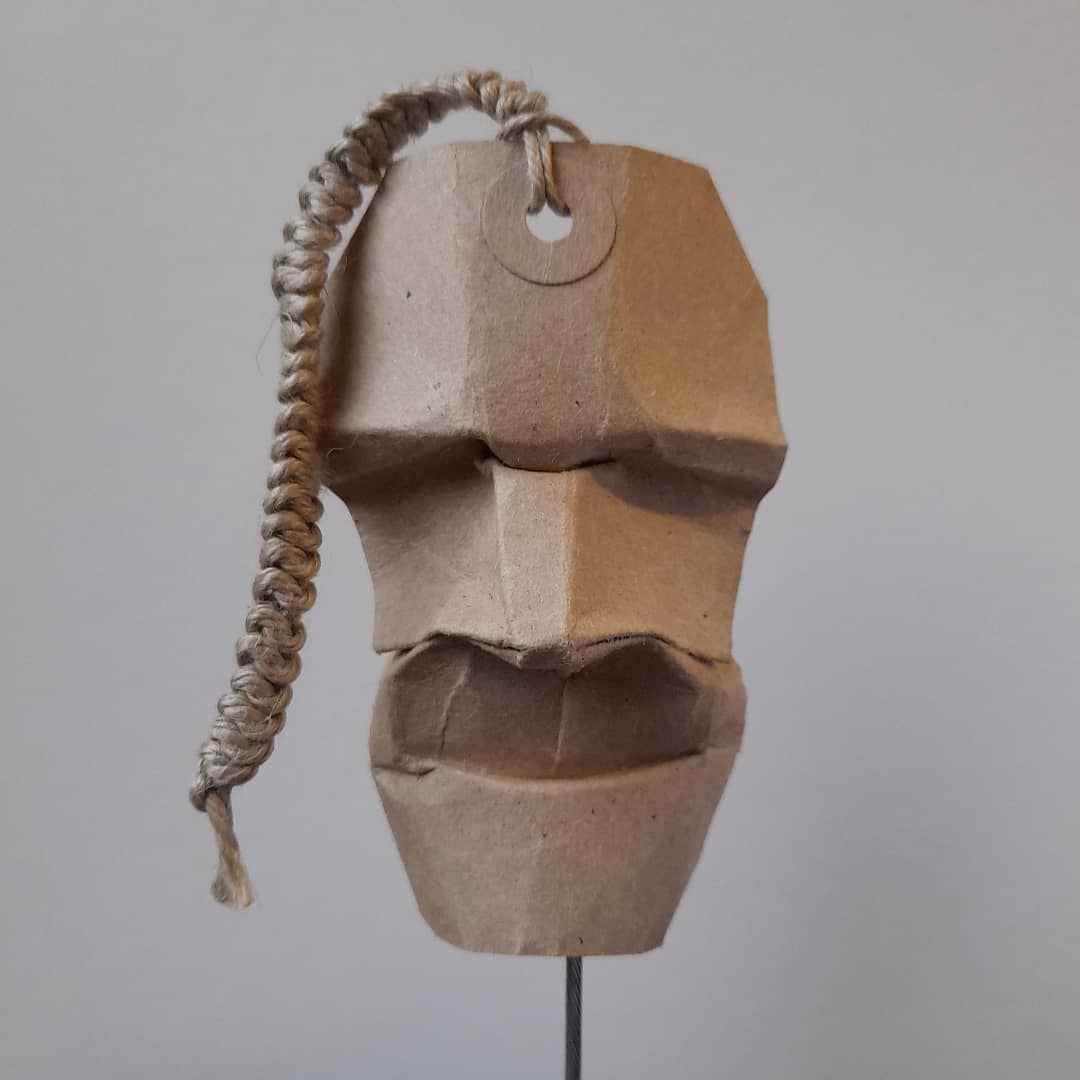 MattBookbinding's tweet photo. Luggage Tag Mask. I taught myself the 'snake knot' braid for this one. I never know how these faces will turn out and there are a lot of failures. It's an idea I seem to be running with though.😊 #origami #mask #origamimask #origamifaces #origamipapertags #origamisculpture #braid https://t.co/awDgORQpI1