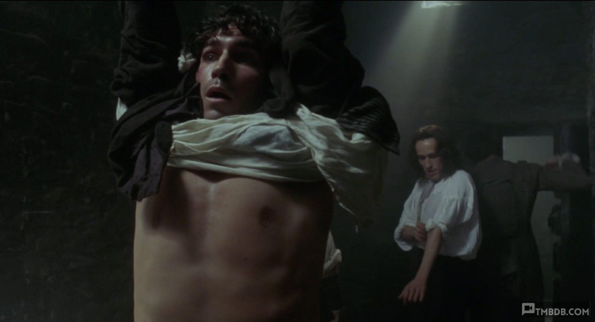tmbdb's tweet photo. Jim Caviezel endures some whipping in a dungeon (after quite the surprise swift raising of his chained wrists), shirt lifted enough to see his nipples but just shy of any armpit scenery. #malebondage #maletorture #whipping #jimcaviezel

 https://t.co/XOIrfICuWZ https://t.co/5BZOMwXTiy