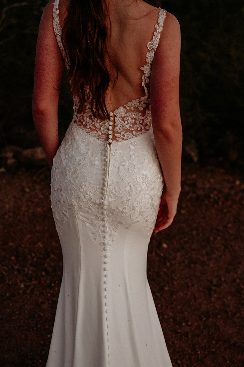 strutbridal's tweet photo. She moves differently when she's in love. She believes anything is possible. This stunning lace low button down fitted dress is available exclusively at Strut bridal Salon! #laceweddingdress #arizonabride #arizonaweddings #rusticwedding #rusticweddingvibes #rusticweddinginspo https://t.co/QHwZ4BHybO