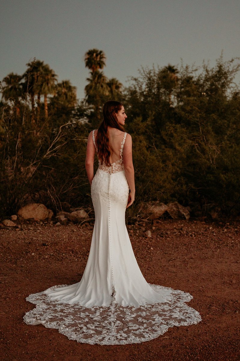 strutbridal's tweet photo. She moves differently when she's in love. She believes anything is possible. This stunning lace low button down fitted dress is available exclusively at Strut bridal Salon! #laceweddingdress #arizonabride #arizonaweddings #rusticwedding #rusticweddingvibes #rusticweddinginspo https://t.co/QHwZ4BHybO