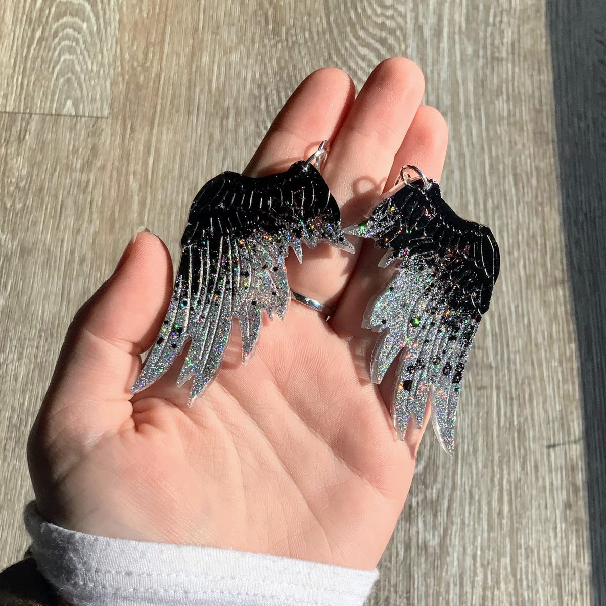 EnderbonesArt's tweet photo. new holographic fallen angel wing earrings on the shop! https://t.co/LWKRur6ByI