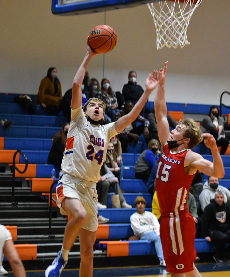 Varsity Boys Basketball @ GKHS:
FINAL: GK 68, Oregon 31.
The Cogs (12-3, 3-0 in BNC) cruised to victory with a balanced scoring attack. Jake Oates had 19 to lead GK. Other top scorers were Alec Golembiewski (13), Colin Nesler (10), Eagan Reams (9), and Nolan Perry (8).