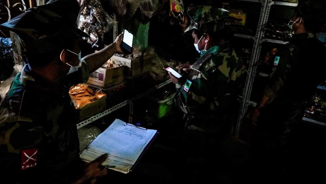 Chanapai247's tweet photo. TNLA has already announced in #KutKhai of Shan North since 5 months ago not to sell any products related to military or having shares with military in any means. Today, they conducted surprise check and destroyed those products with the allowance of shopkeepers.

#2022Jan9Coup https://t.co/rXtZb4If8e