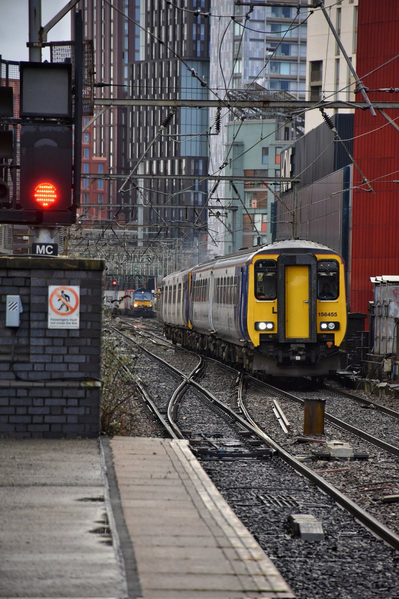 upsidedownhead5's tweet photo. Here we see @northernassist Sprinter unit 156455 with 150144 on the rear sneaking out of #Manchester Oxford Road while @GBRailfreight 66780 "Cemex Express" waits patiently for them to clear Deansgate. #railway #train #railpic #railwayphotography #ukrail https://t.co/gDd9z6cExS