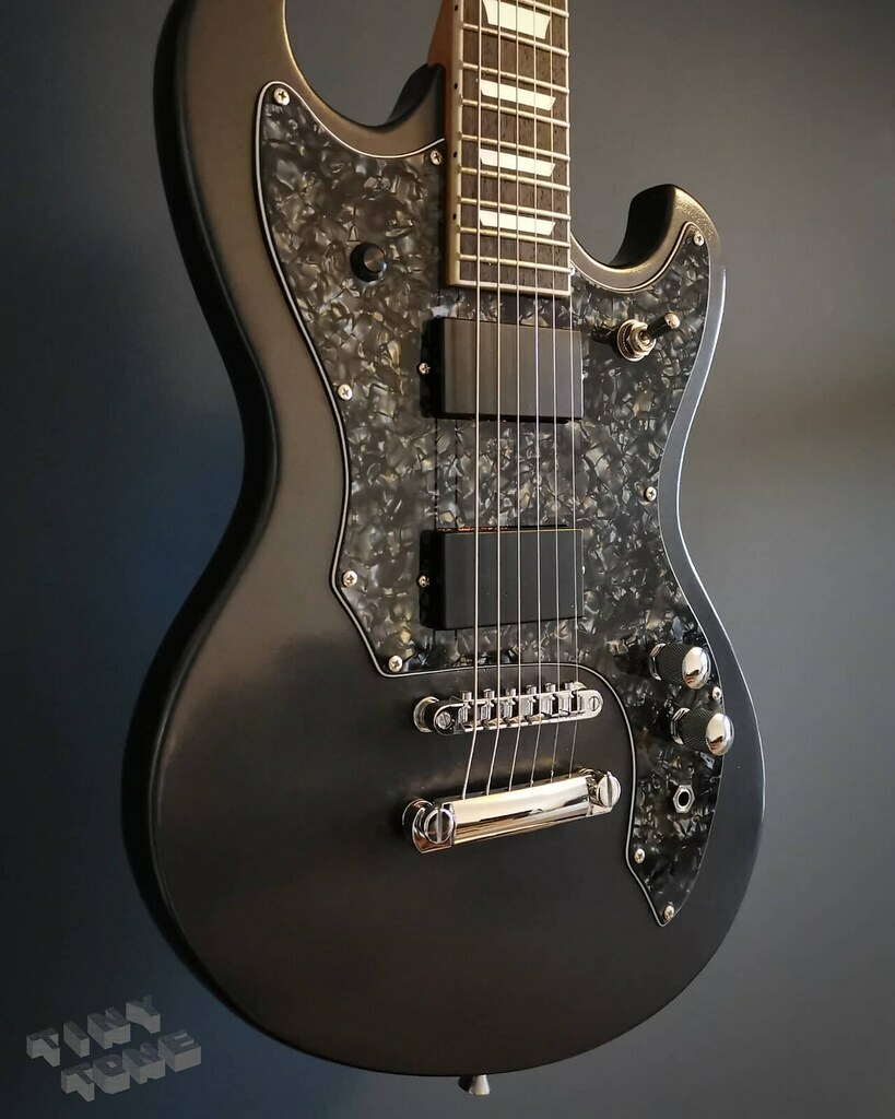 Jack_Ellis's tweet photo. Lets give a big round of applause for PEARL BLACK the deep 'n' moody pickguard sheet choice! Gareth sent in his template for his jaguar / SG hybrid restoration job and this is the resulting pickguard we made #pearlblack #sg #jaguar #scratchplate #customsc https://t.co/luNBgdlJYz
