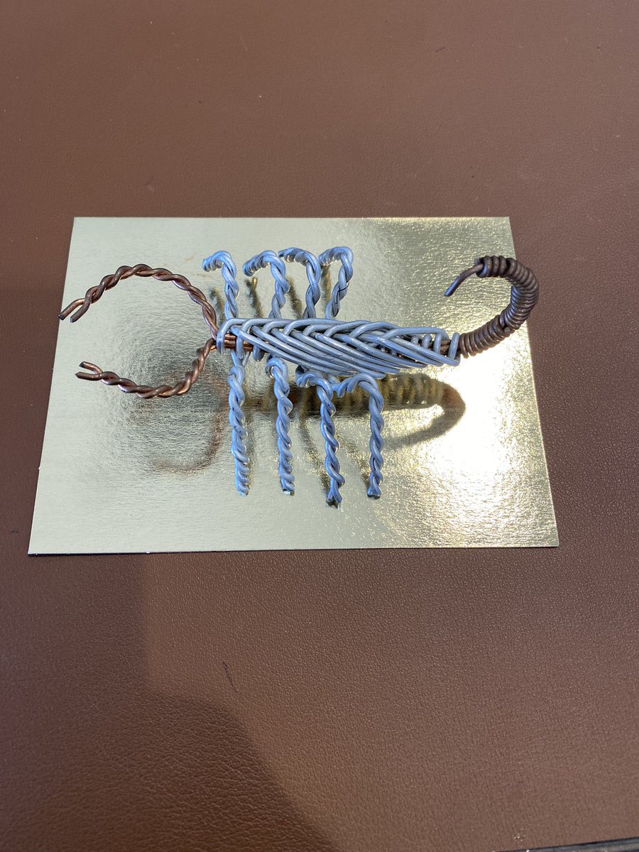 DrPollard_AACC's tweet photo. It’s Inauguration Week @NevadaState & we are #BackandBold. Today I was greeted with a poignant gift from a faculty colleague. Made from discarded materials,he shared this talisman of our audacious mission: education that celebrates who we include instead of who we exclude. 💛🖤🦂 https://t.co/kfMqlRatx9