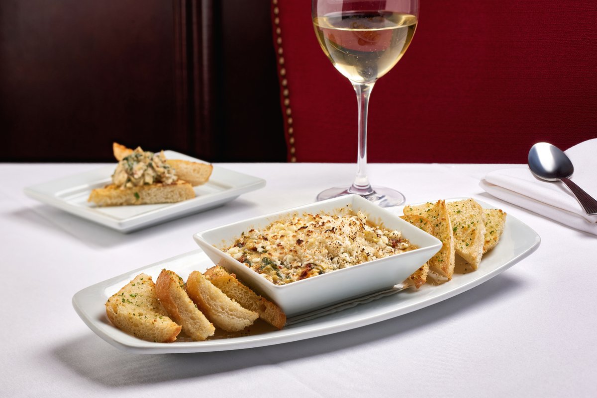 Our new Goat Cheese &amp; Artichoke Dip is the perfect shareable appetizer to begin an incredible night out.