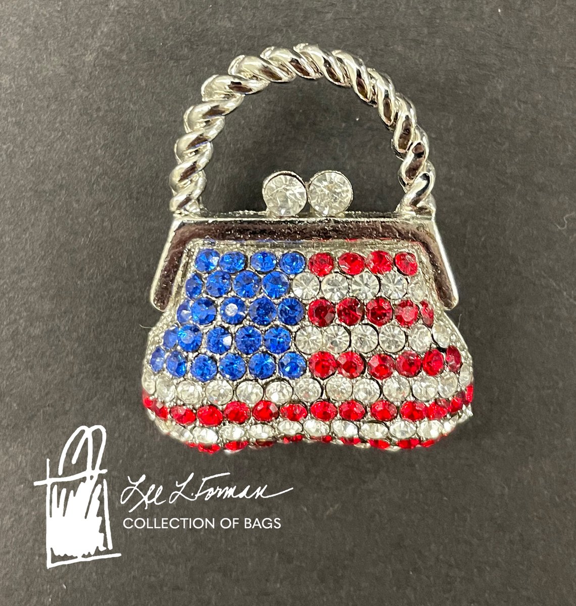 11/365: Just how small can they get? This silver handbag pin is only 1 inch wide and features the American flag in red, white, and blue stones.