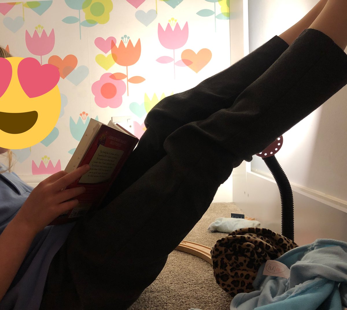 She was reading The Diary of a Christmas Elf like this for nearly an hour this evening… could not put it down! Made my week!