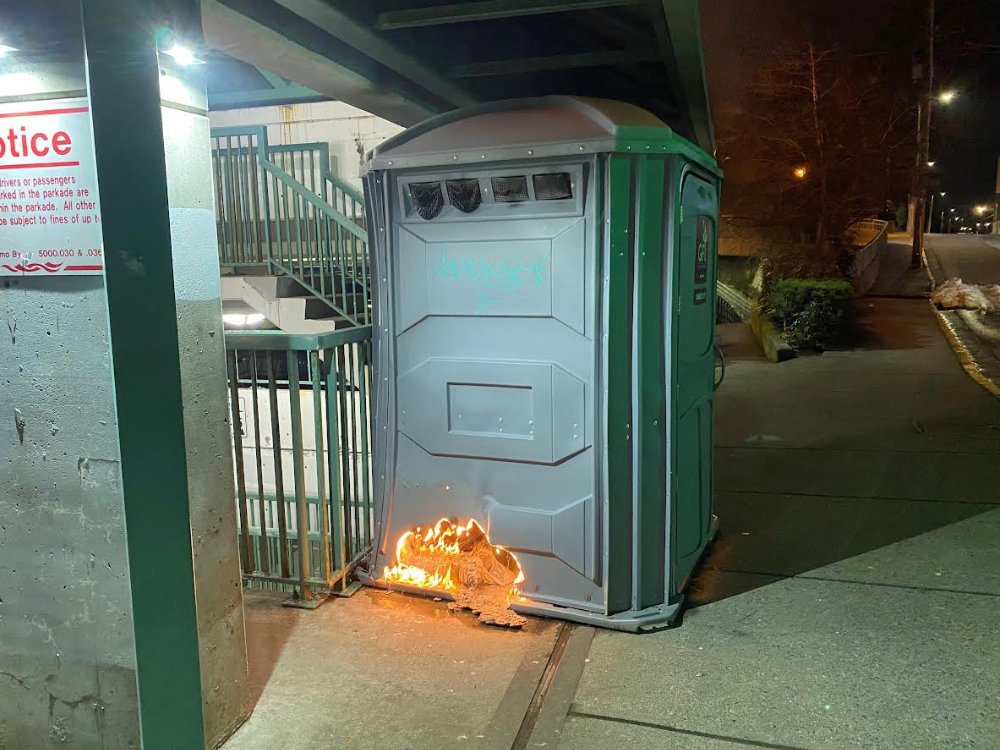 chriswindeyer's tweet photo. The Nanaimo RCMP, investigating a porta pottie arsonist, have just released the perfect photo for our times: https://t.co/vGLkitCCID