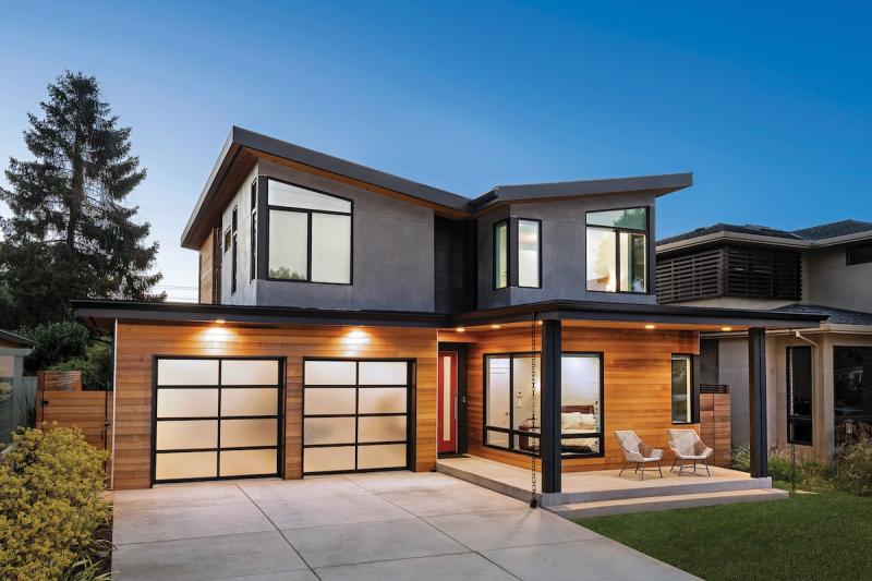 Natural sealed cedar, dark gray stucco, and black steel create a modern exterior that blends into the wooded site of this California prefab custom home design by Method Homes. Check out the full prefab process here: loom.ly/jEdoqQo