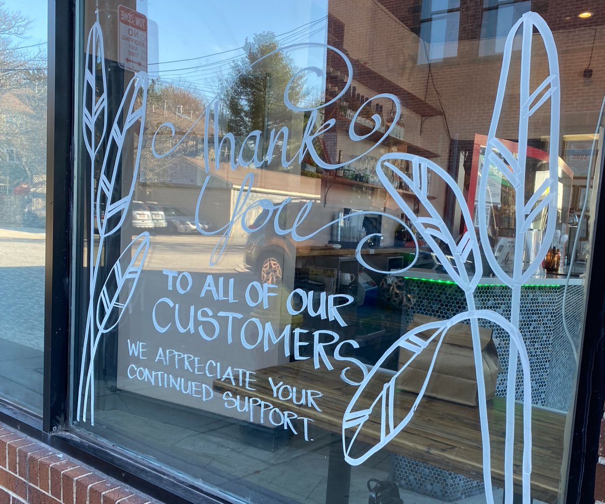 window glass with writing, "thank you to all our customers for your support"
