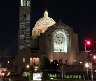 Aluwir's tweet photo. Light Show in Washington; Law and Life; Masks Back On https://t.co/HzsDcZUFK9 via @Aluwir A slogan on the Washington Basilica. A new mask rule in central Minnesota. #America #CommonGood #COVID19 #faith #FaithAndWorks #health #LifeIssues #CABLGP https://t.co/Xqrq16wKJs