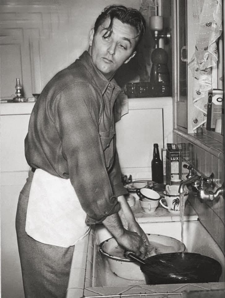 Robert Mitchum washing dishes at the Chateau Marmont, Los Angeles. #RobertMitchum #filmnoir