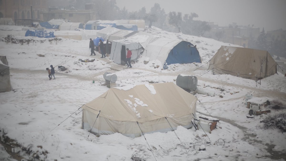 MarkCutts's tweet photo. #Syria: Snow, rain and cold weather continue to make life very difficult for displaced people in camps, like this one in Idlib. 

Meanwhile, humanitarian organizations are continuing to clear roads, repair or replace damaged shelters and provide emergency support https://t.co/h38PS2u7vF