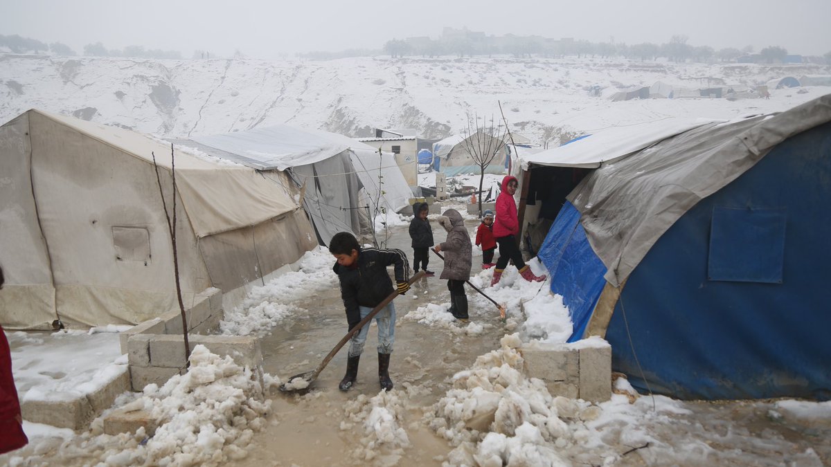 MarkCutts's tweet photo. #Syria: Snow, rain and cold weather continue to make life very difficult for displaced people in camps, like this one in Idlib. 

Meanwhile, humanitarian organizations are continuing to clear roads, repair or replace damaged shelters and provide emergency support https://t.co/h38PS2u7vF