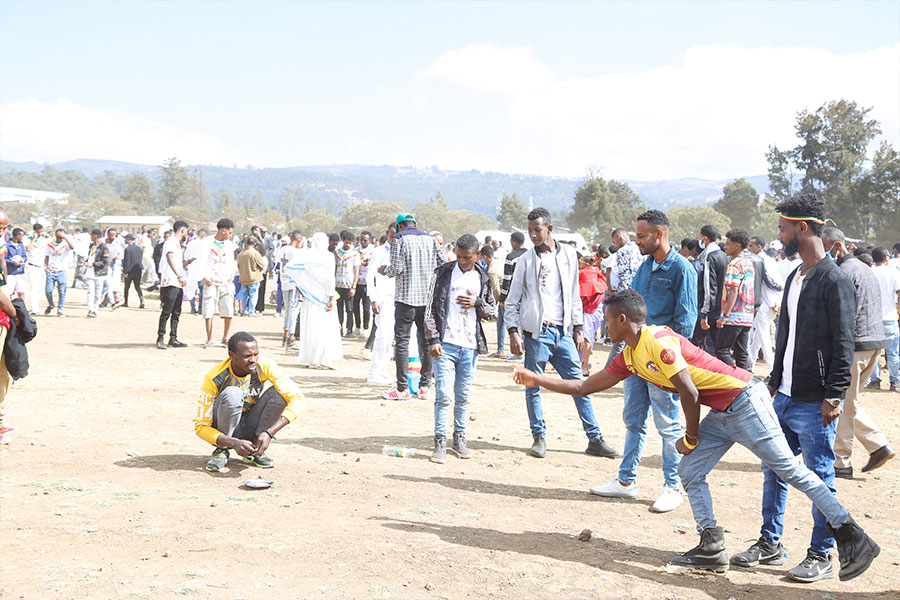 addis_fortune's tweet photo. IN-PICTURE: #Timqet (Epiphany) was celebrated in Jan Meda, #AddisAbeba, with usual warmth, with holy water sprinkled on participants as is part of the tradition. But there were also other activities, including youth playing games. Some played trying to land a coin on target. https://t.co/jzEy5xBdYB