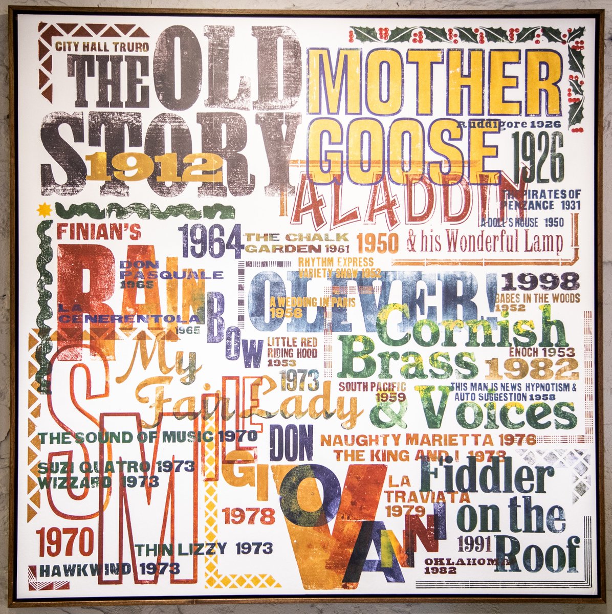 HallforCornwall's tweet photo. For today’s #MondayMemory, we're looking back at performances from 1912 to 2018 through our Performance Timeline. These panels are a feature in our Green Room café, celebrating the history of performance in our building, created by renowned tyopgrapher &amp; printmaker Alan Kitching. https://t.co/CnpFJwR15s