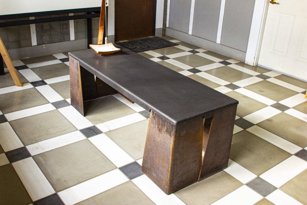 This concrete &amp; steel bench adorning a lobby at the #sonomacaststone plant would look just as amazing in a garden, or tasting room. The floor is done in concrete tiles.
#restorationhardware #moderndesign #interiordesign #interiordesigners #design #style #modernhome #architecture